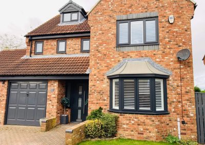 Wooden window shutters supplied and fitted in Newcastle upon Tyne and across the North East by Signature Window Shutters. White Bay window shutters in Northumberland