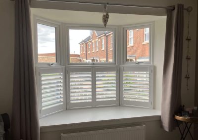 Cafe style bay window window shutters supplied and fitted in Newcastle upon Tyne and across Northumberland by Signature Window Shutters.