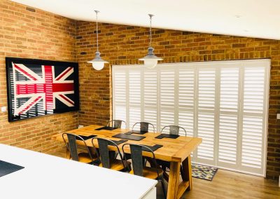 Plantation shutters for windows and doors supplied and fitted in Newcastle upon Tyne and across the North East by Signature Window Shutters. Bi-fold sliding track doorway shutters