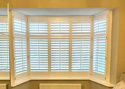 Bay window shutters supplied and fitted in Newcastle upon Tyne and across the North East by Signature Window Shutters. White Shutters with tilt rods