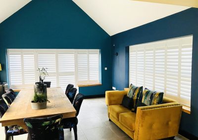 Plantation shutters for windows and doorways supplied and fitted in Newcastle upon Tyne and across the North East by Signature Window Shutters. Bi-fold shutters on a sliding track