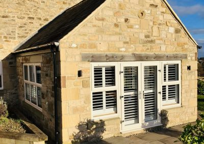Plantation shutters for windows and doorways supplied and fitted in Newcastle upon Tyne and across the North East by Signature Window Shutters. Bi-fold shutters on a sliding track
