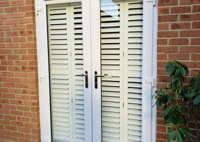 Plantation shutters for doorways supplied and fitted in Newcastle upon Tyne and across the North East by Signature Window Shutters. Bi-fold shutters on a sliding track