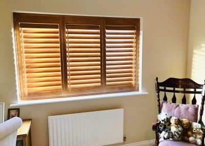 Stained wooden Plantation window shutters supplied and fitted in Newcastle upon Tyne and across the North East by Signature Window Shutters