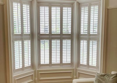 Tier on Tier bay window shutters, supplied and fitted by Signature Window Shutters in Newcastle upon Tyne. Wooden window shutters for bay windows are our speciality!