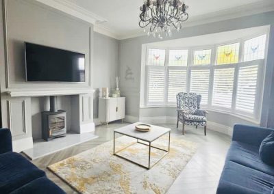 White cafe style plantation shutters. Shutter blinds for bay windows, cafe style plantation shutters