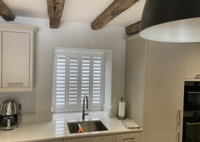 Full height white wooden shutters for windows. Plantation shutters supplied and fitted by Signature Window Shutters Newcastle & Northumberland