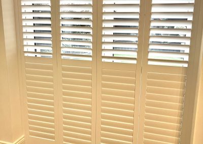 Plantation shutters for doorways. Sliding track shutters for patio doors with split tilt operation