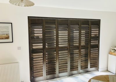 Hardwood Plantation shutters for doorways. Black Hardwood bi fold shutters supplied and fitted by Signature Window Shutters in Newcastle upon Tyne, Gateshead & Northumberland
