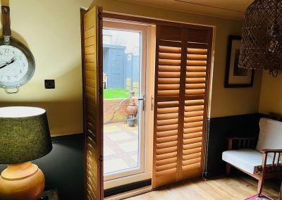 Stained hardwood shutters for windows and doorways - plantation shutters made to measure. Supplied and fitted by Signature Window Shutters in Newcastle, Gateshead & Northumberland