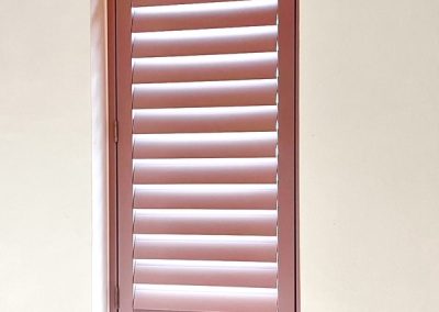 Waterproof bathroom window shutters - pink plantation shutters made to measure. Supplied and fitted by Signature Window Shutters in Northumberland