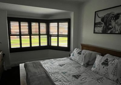 Black window shutters made to measure. Plantation shutters custom made for bay windows. Supplied and installed by Signature Window Shutters in Newcastle, Gateshead, Durham & Northumberland