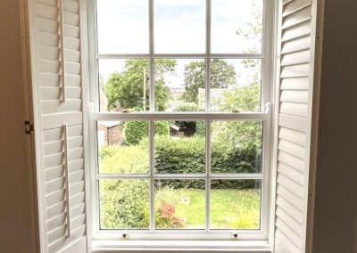 Window shutters with integrated blackout blinds by Signature Window Shutters Newcastle